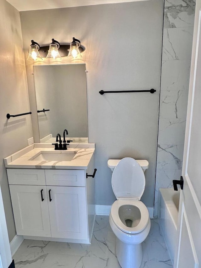 bathroom with vanity, tile patterned flooring, and toilet