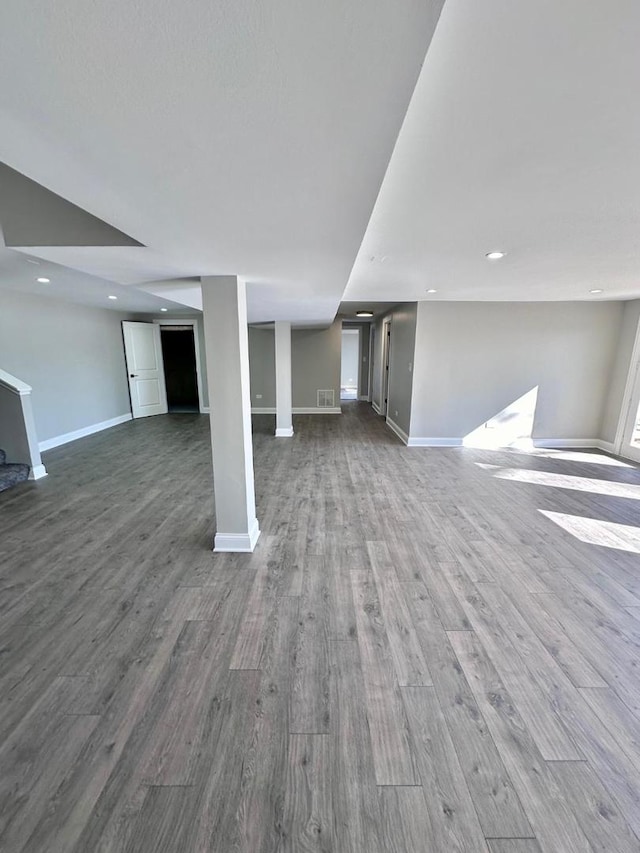 unfurnished living room with wood-type flooring