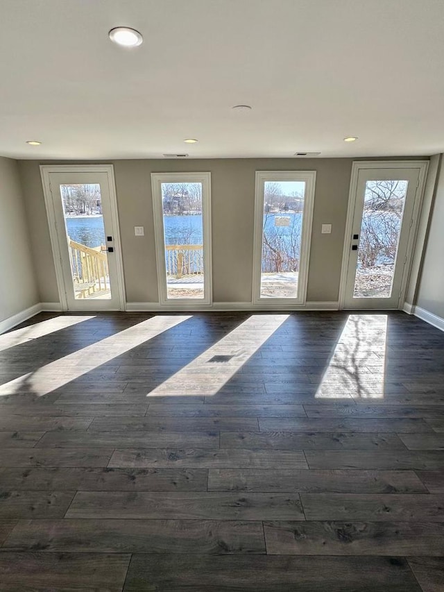 foyer entrance with dark hardwood / wood-style floors