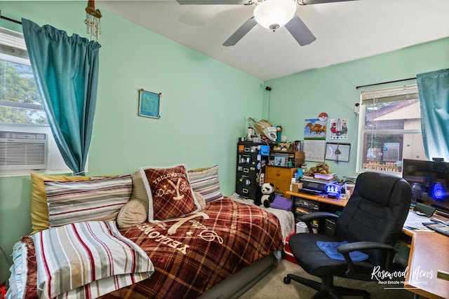 carpeted bedroom featuring ceiling fan, cooling unit, and multiple windows