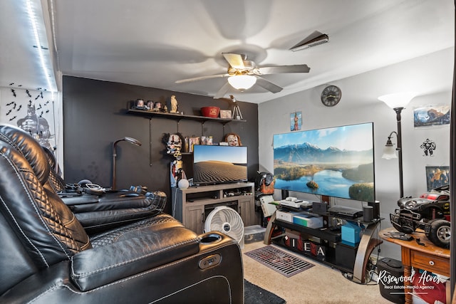 carpeted living room featuring ceiling fan