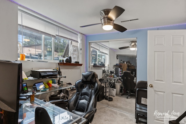 carpeted home office with ceiling fan