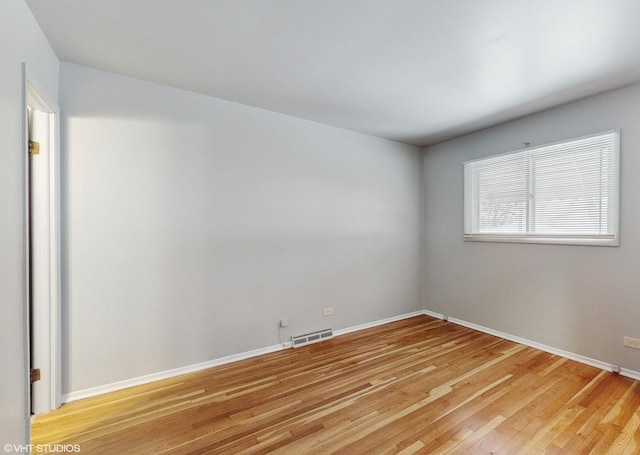 unfurnished room featuring light hardwood / wood-style floors