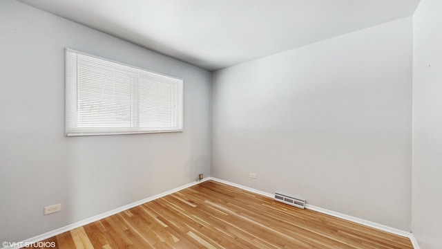 spare room featuring hardwood / wood-style flooring