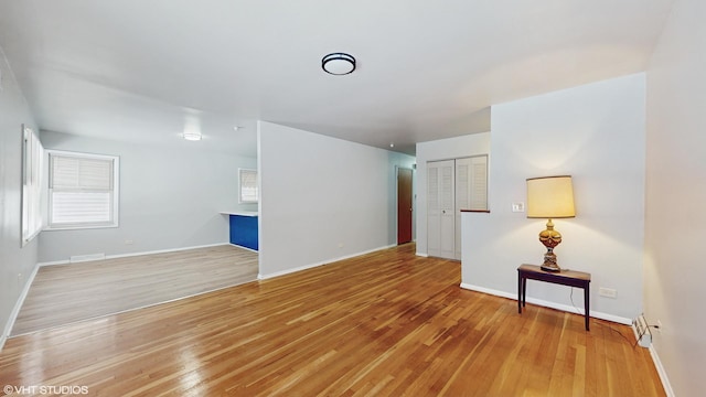 unfurnished living room with light wood-type flooring