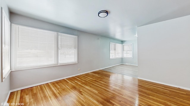 empty room with hardwood / wood-style flooring