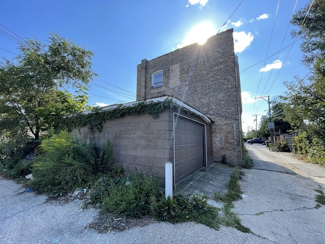 view of property exterior with a garage