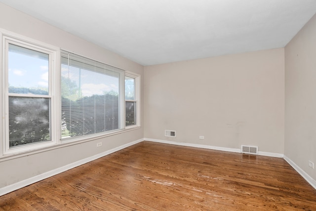 unfurnished room featuring hardwood / wood-style floors