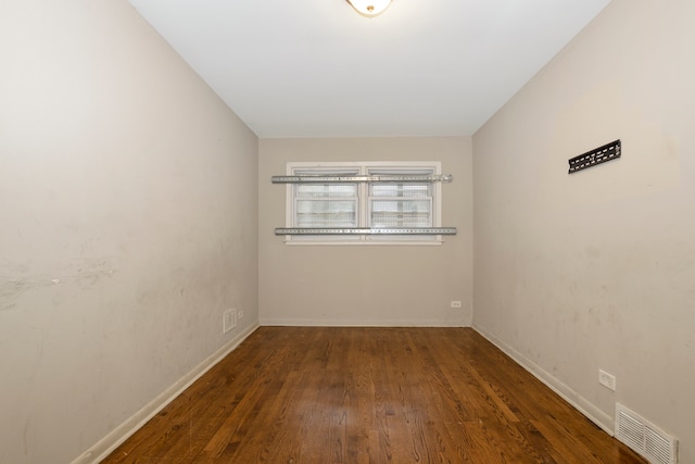 unfurnished room featuring dark hardwood / wood-style floors