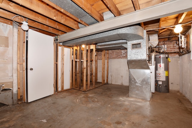 basement with gas water heater and heating unit