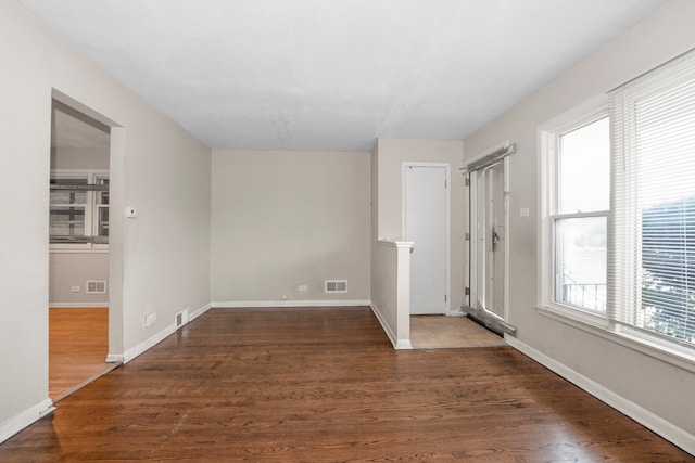 empty room featuring dark hardwood / wood-style floors