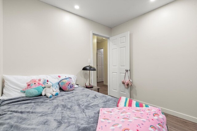 bedroom featuring hardwood / wood-style floors