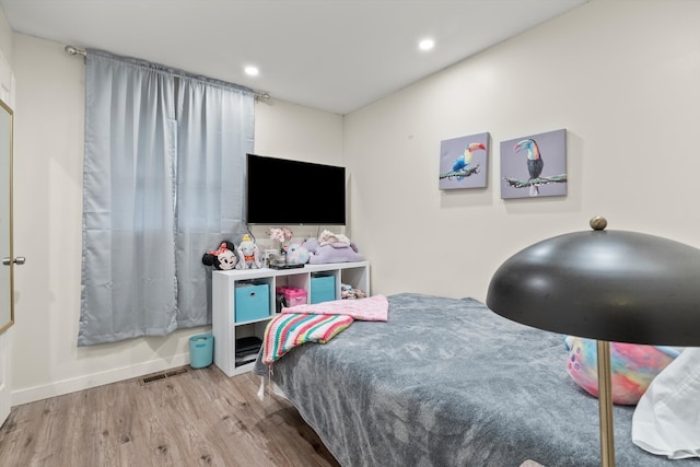 bedroom with light wood-type flooring