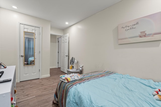 bedroom with light wood-type flooring