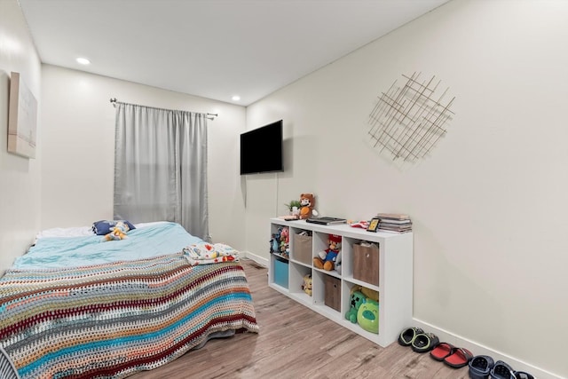 bedroom with light wood-type flooring