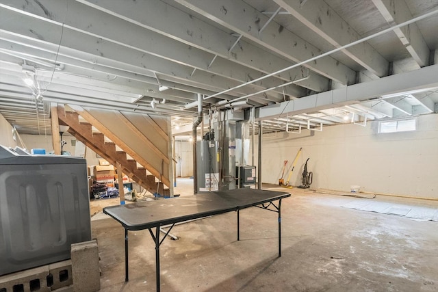 basement featuring heating unit and gas water heater