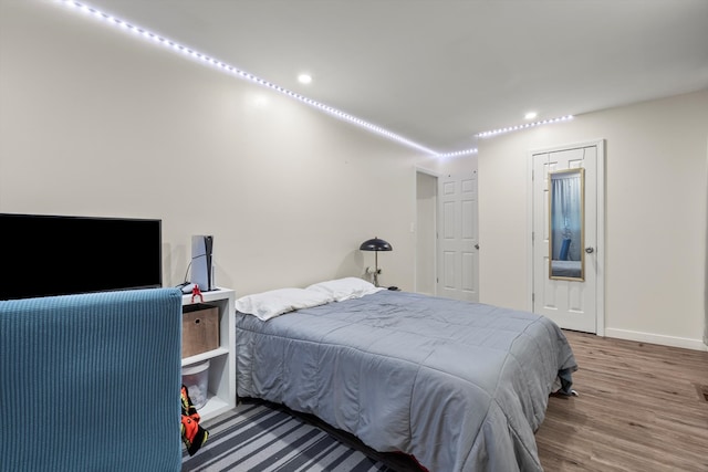 bedroom with wood-type flooring