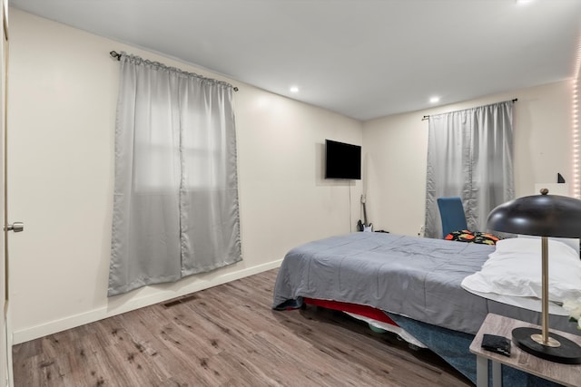 bedroom featuring wood-type flooring