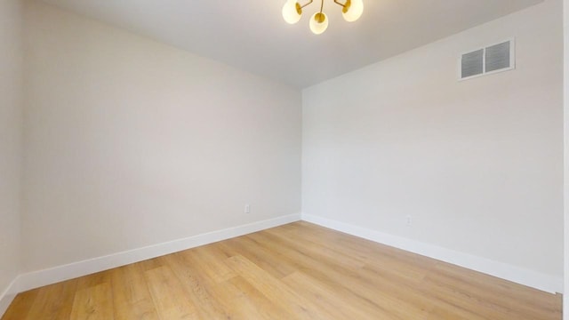 unfurnished room featuring wood-type flooring