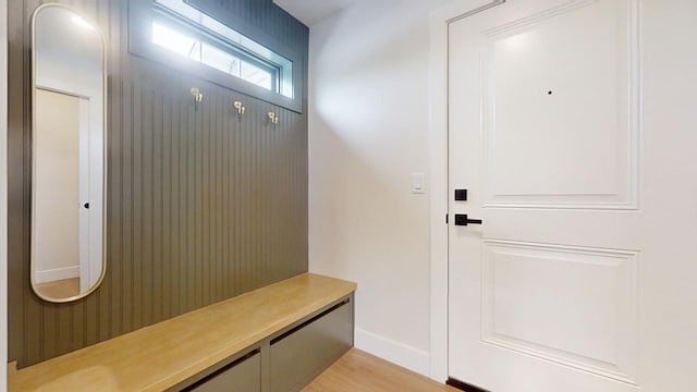 mudroom with light hardwood / wood-style flooring