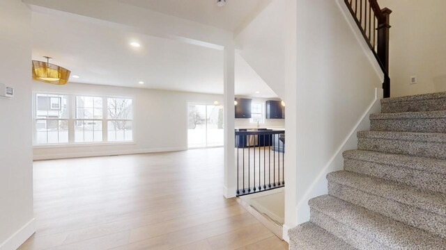 staircase featuring hardwood / wood-style floors