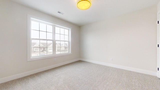 unfurnished room featuring carpet flooring