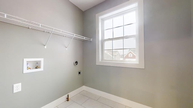 washroom with washer hookup, electric dryer hookup, and light tile patterned flooring