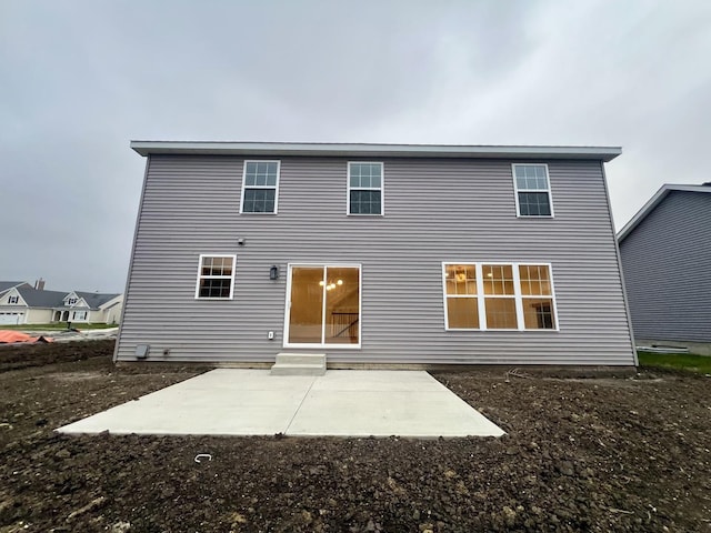 back of property featuring a patio