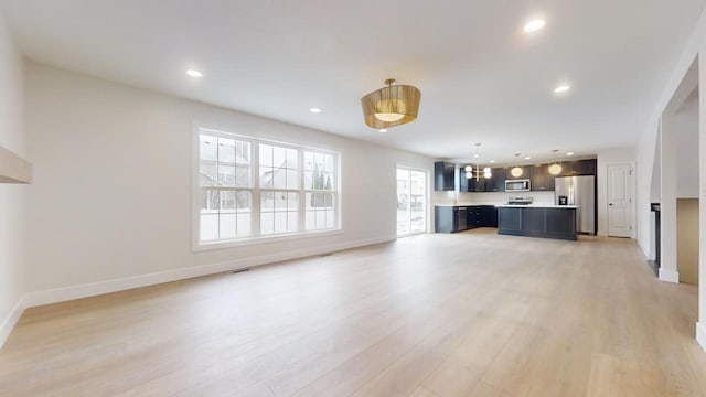 unfurnished living room featuring light hardwood / wood-style flooring