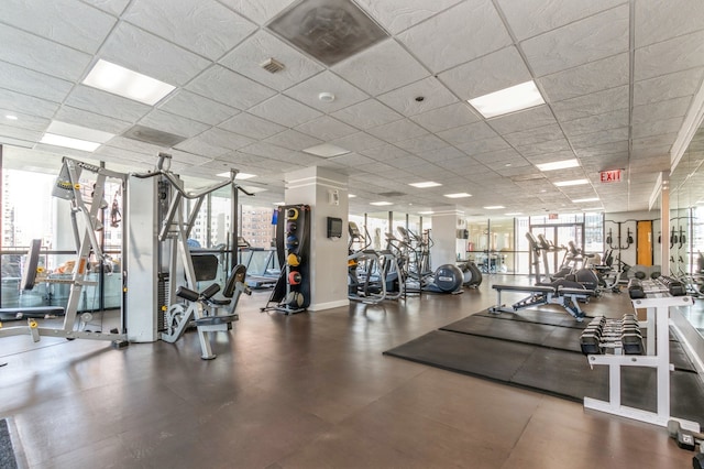 exercise room featuring a paneled ceiling