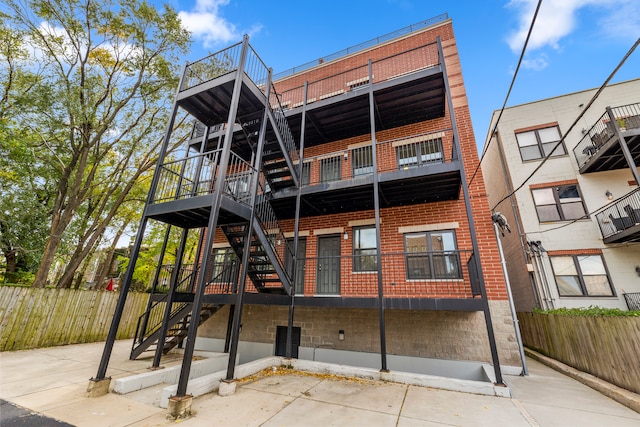 rear view of house featuring a balcony