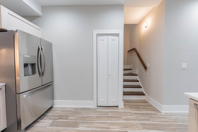 kitchen with stainless steel fridge with ice dispenser