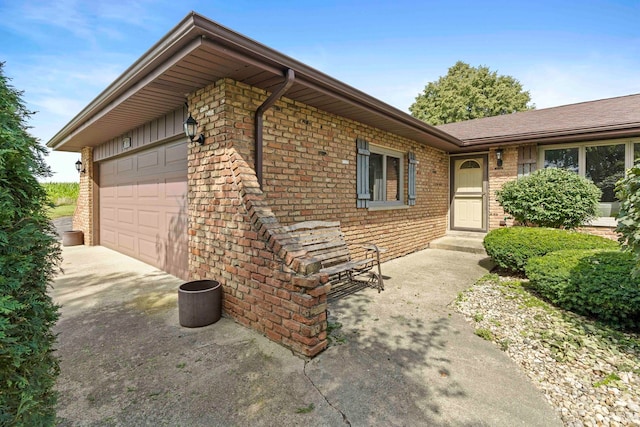 view of side of home featuring a garage