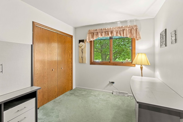 office with lofted ceiling and carpet floors