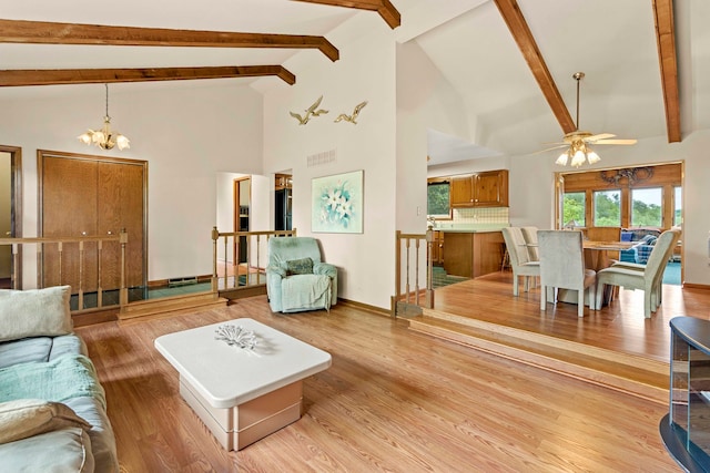 living room featuring high vaulted ceiling, beamed ceiling, ceiling fan with notable chandelier, and light hardwood / wood-style floors