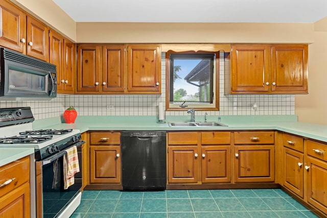 kitchen featuring tile patterned floors, sink, black appliances, and backsplash