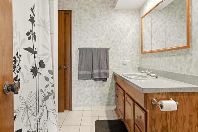 bathroom with tile patterned floors and vanity