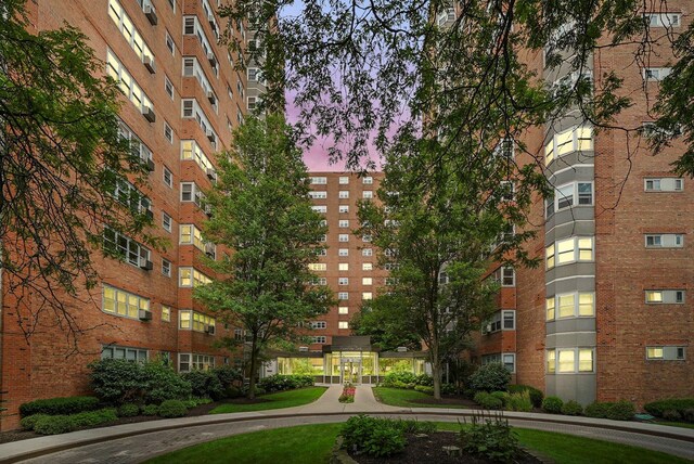 view of outdoor building at dusk