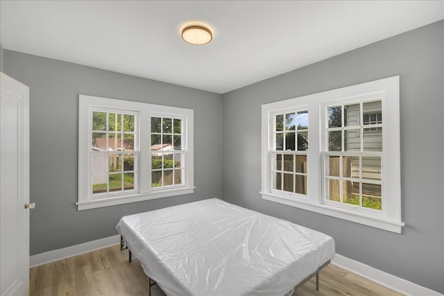 bedroom with light wood-type flooring