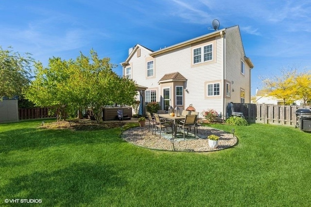 rear view of property with a patio area and a lawn