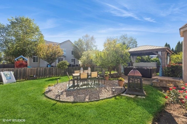 view of yard featuring a gazebo, a hot tub, and a patio area