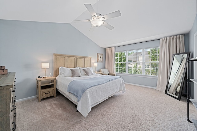 bedroom featuring ceiling fan, light carpet, and high vaulted ceiling