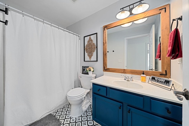 bathroom featuring vanity and toilet