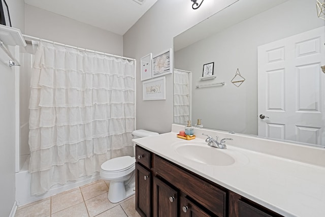 full bathroom featuring tile patterned floors, vanity, toilet, and shower / bath combo with shower curtain