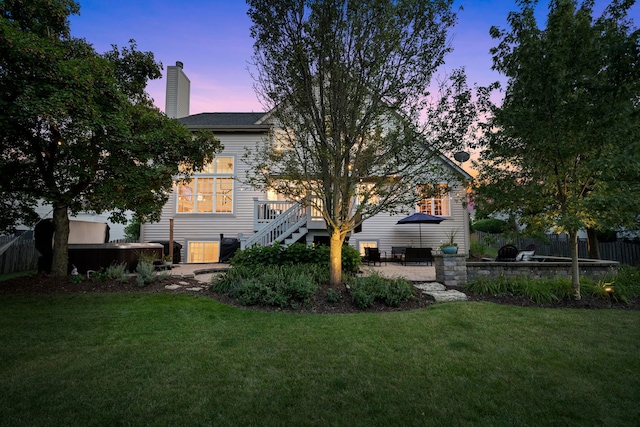 yard at dusk with a patio