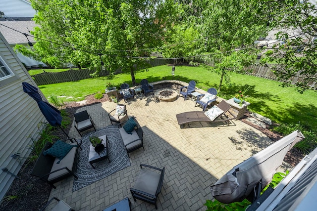 view of patio / terrace with an outdoor living space with a fire pit