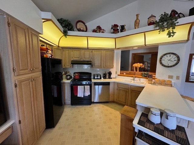 kitchen with light tile patterned floors, vaulted ceiling, black appliances, kitchen peninsula, and decorative backsplash