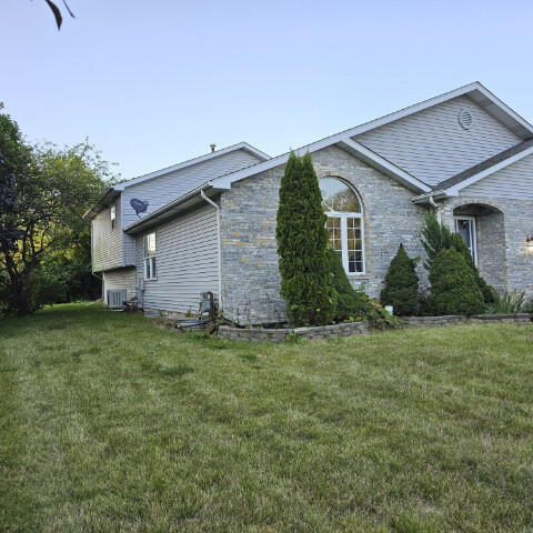 view of property exterior featuring a yard