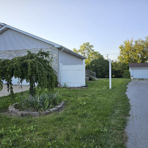 view of yard featuring a garage