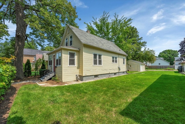 view of side of home featuring a lawn